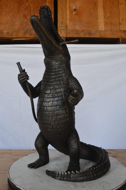 Alligator having fun bronze statue - fountain -  Size: 15"L x 15"W x 31"H.
