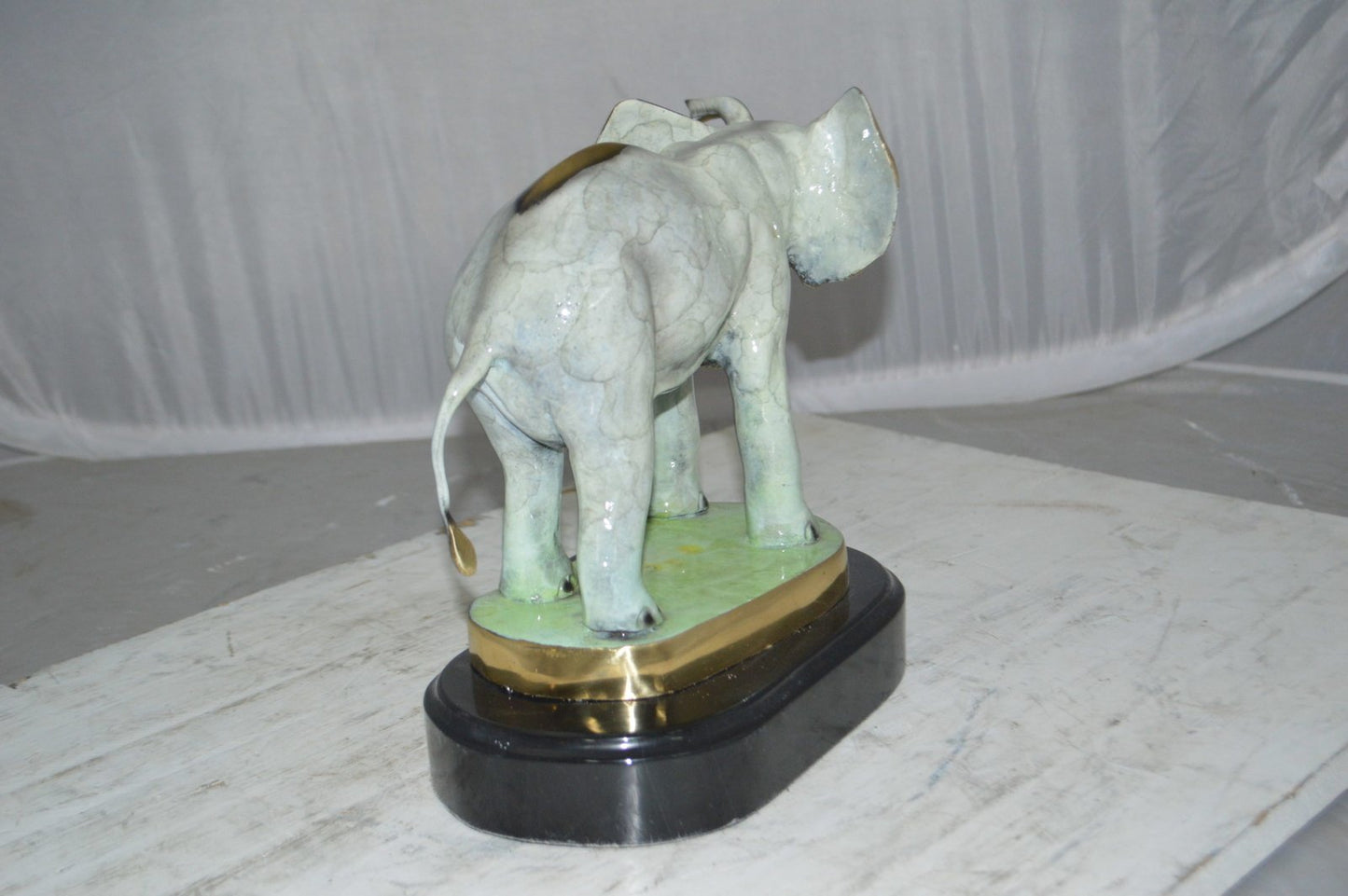 Elephant trunk Up Bronze Statue -  Size: 16"L x 9"W x 10"H.