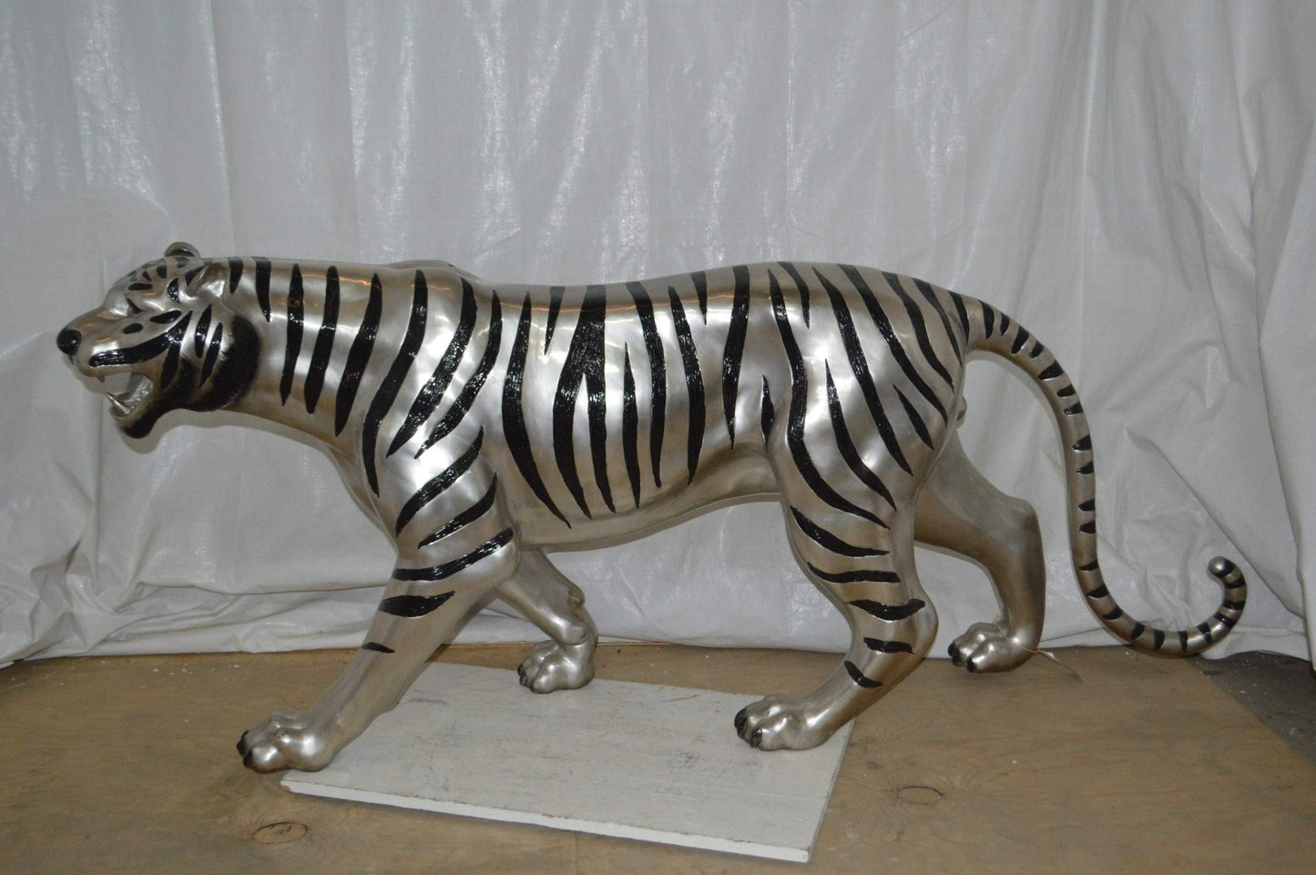 Tiger bronze statue with black and silver finish - Size: 80"L x 15"W x 34"H.