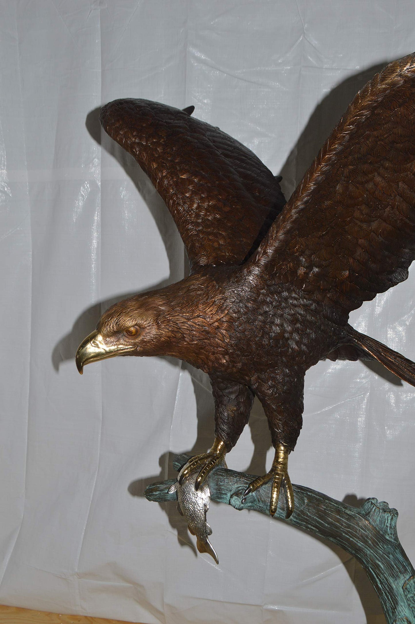 Eagle on a Tree Branch Bronze Statue -  Size: 44"L x 50"W x 65"H.
