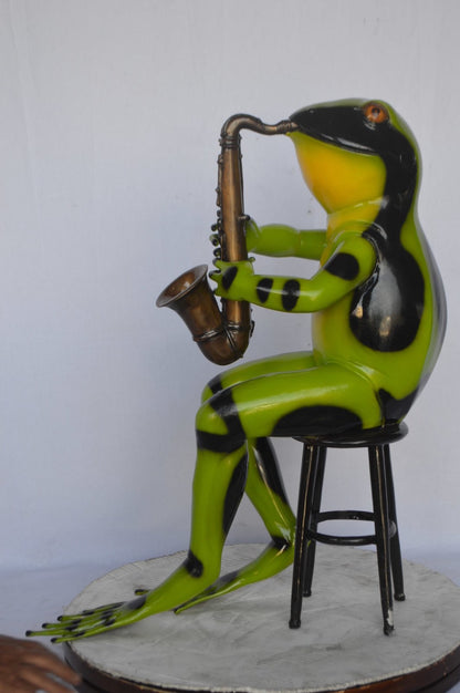Green frog playing saxophone bronze statue - Size: 23"L x 15"W x 30"H.