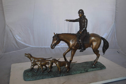 Hunter with three dogs Bronze Statue -  Size: 27"L x 6"W x 18"H.