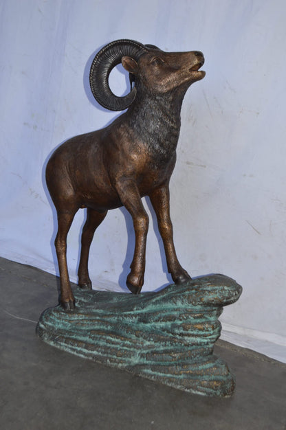 Life Size Ram standing on a rock Bronze Statue - Size: 38"L x 19"W x 45"H.