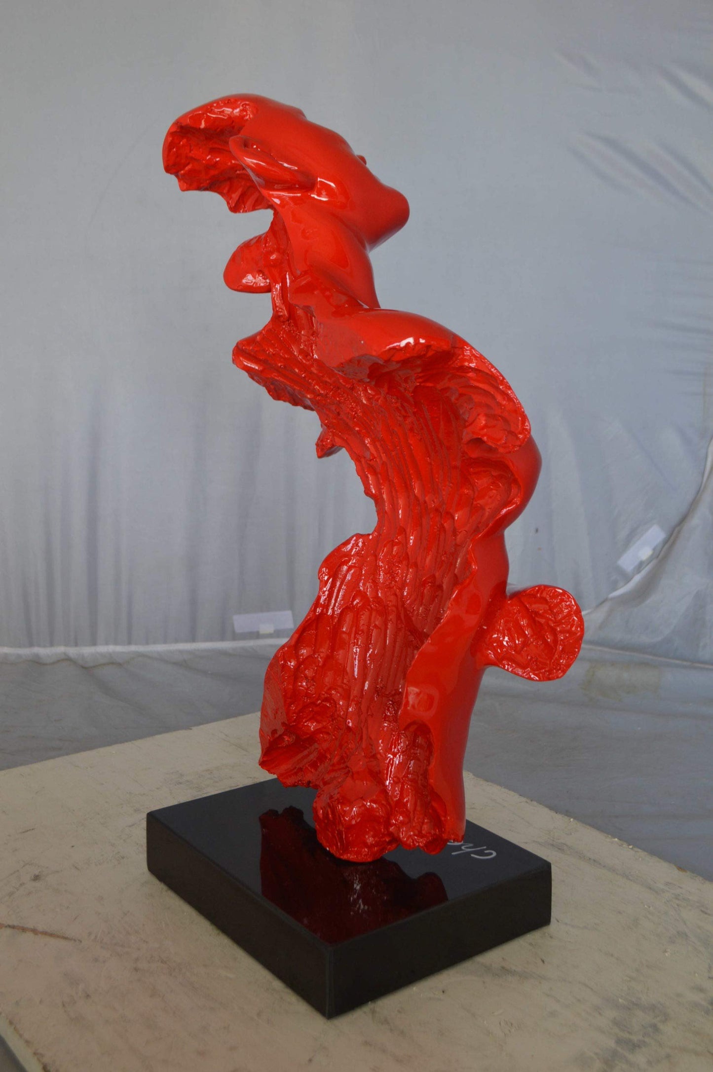 Modern resin statue of a woman hugged by a men -  Size: 13"L x 9"W x 24"H.