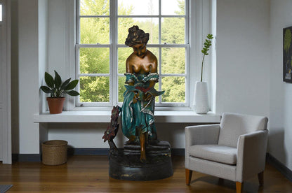 Lady holding a bird bronze statue - Size: 10"L x 9"W x 20"H.