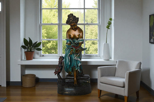 Lady holding a bird bronze statue - Size: 10"L x 9"W x 20"H.