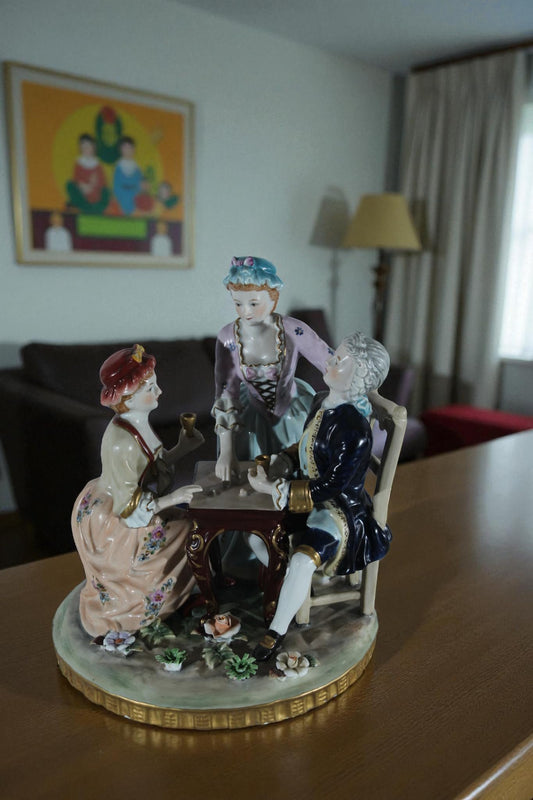 NIFAO Porcelain Figurine Group at Table with Cups 10"x10"x13"H