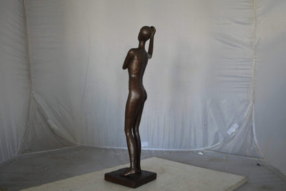Abstract of Art nude lady lifting hand bronze statue - Size: 9"L x 6"W x 25"H.