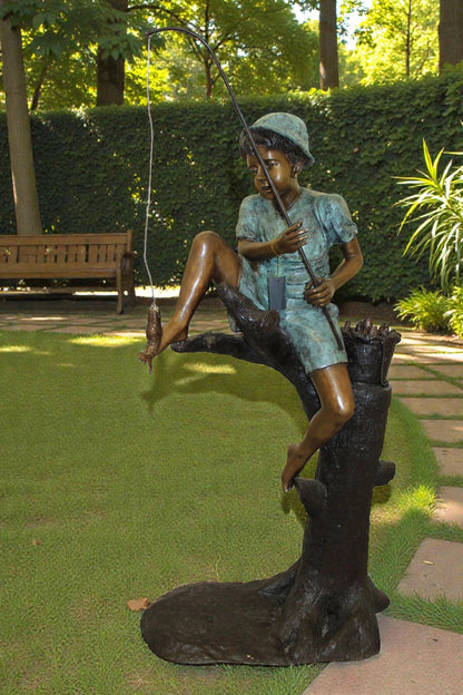 Boy Sitting on a Tree and Fishing Bronze Statue -  Size: 34"L x 28"W x 64"H.