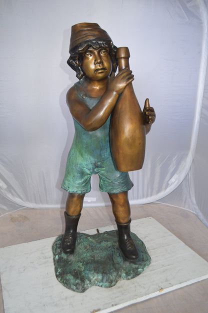 Boy holding a bottle water fountain -  Size: 17"L x 14"W x 38"H.