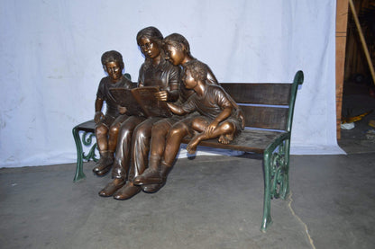 Mom and boys reading stories on bench bronze statue - Size: 53"L x 33"W x 39"H.