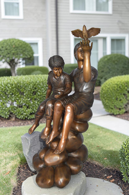 Two Kids on Rocks with a Bird Bronze Statue -  Size: 36"L x 30"W x 44"H.