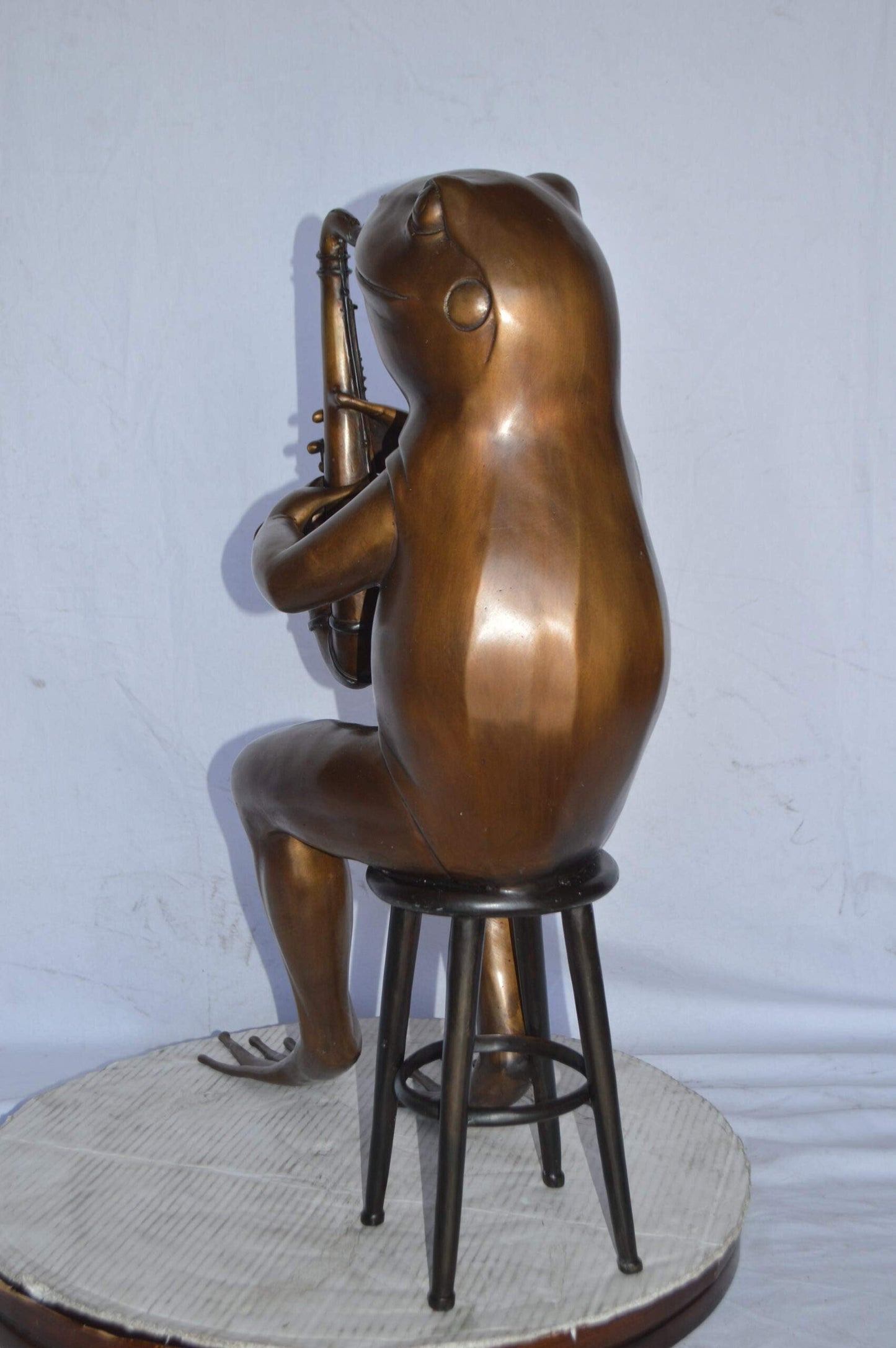 Frog playing saxophone bronze statue - Size: 23"L x 15"W x 30"H.