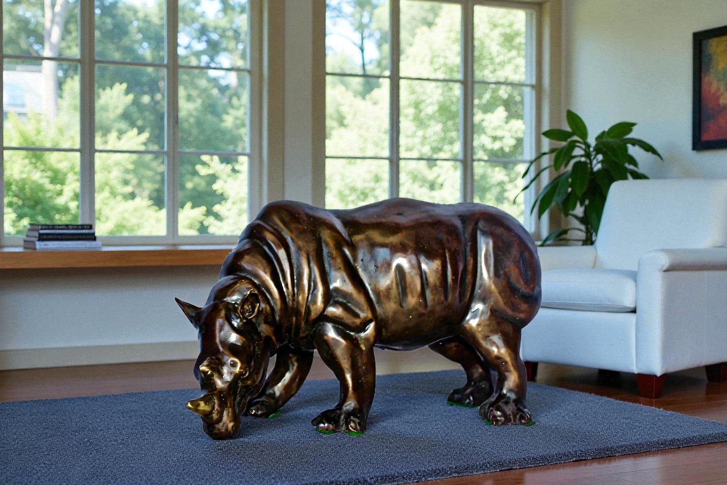 Relaxed Rhino bronze statue -  Size: 16"L x 9"W x 8"H.