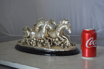 Charging horses resin statue on wood base - Size: 17"L x 10"W x 5"H.