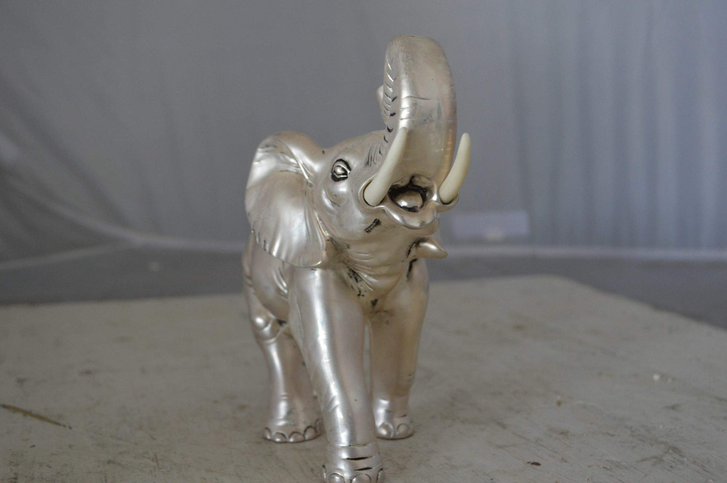 Elephant statue made of resin - Size: 9"L x 4"W x 8"H.