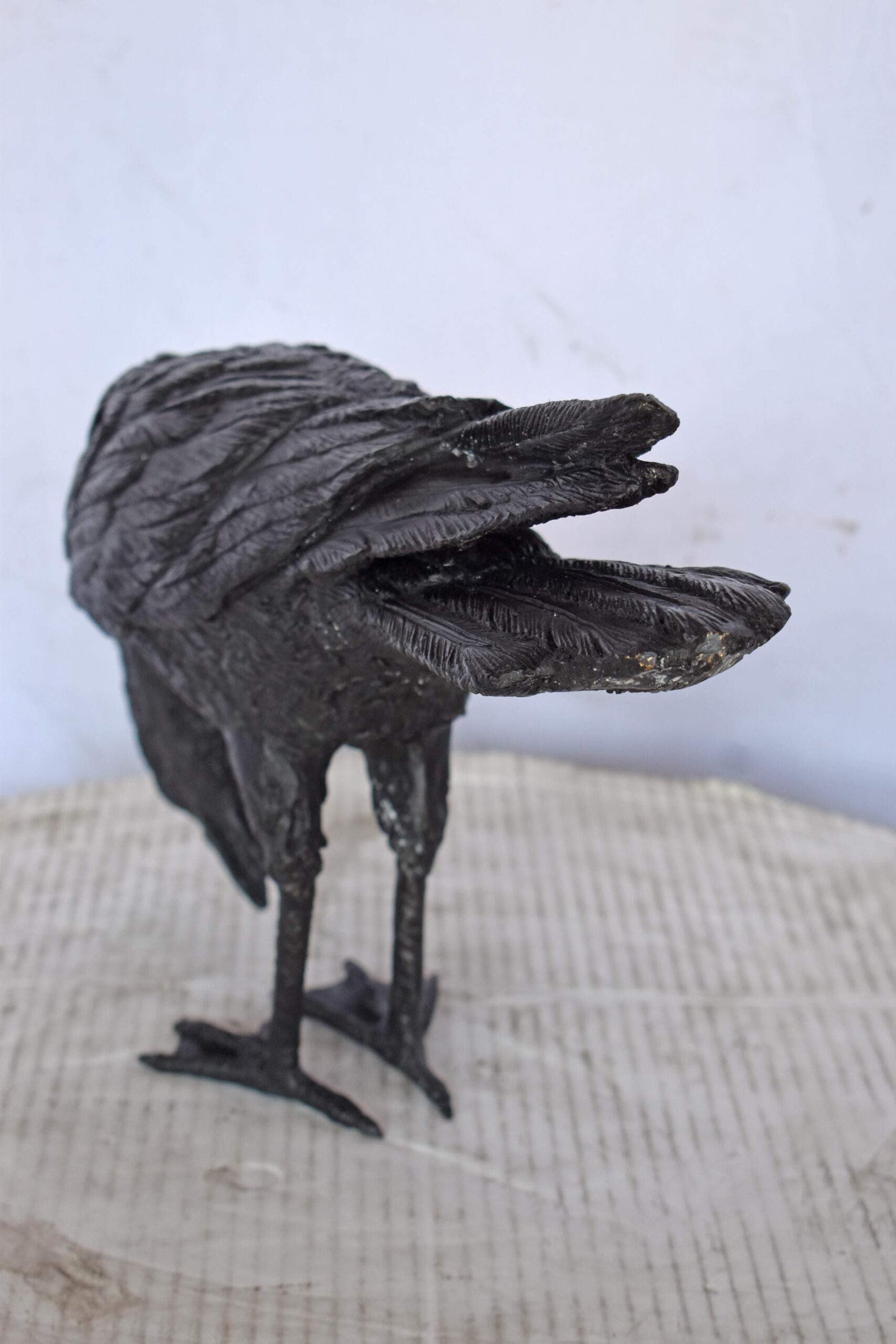 Raven Looking Down Bronze State - Size: 19"L x 5"W x 11"H.