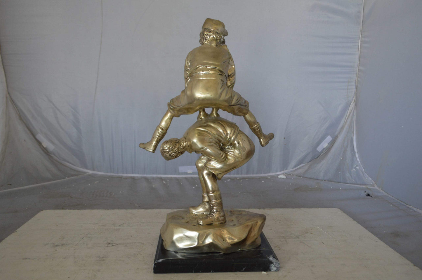 Leapfrog bronze statue silver finish  - Size: 12"L x 7"W x 19"H.