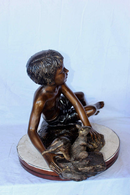 Adventurous boy with squirrel bronze statue -  Size: 36"L x 18"W x 22"H.