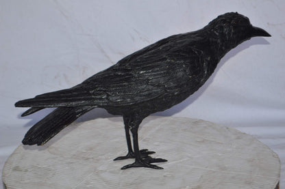 Raven with his head up Bronze Statue - Size: 23"L x 6"W x 13"H.