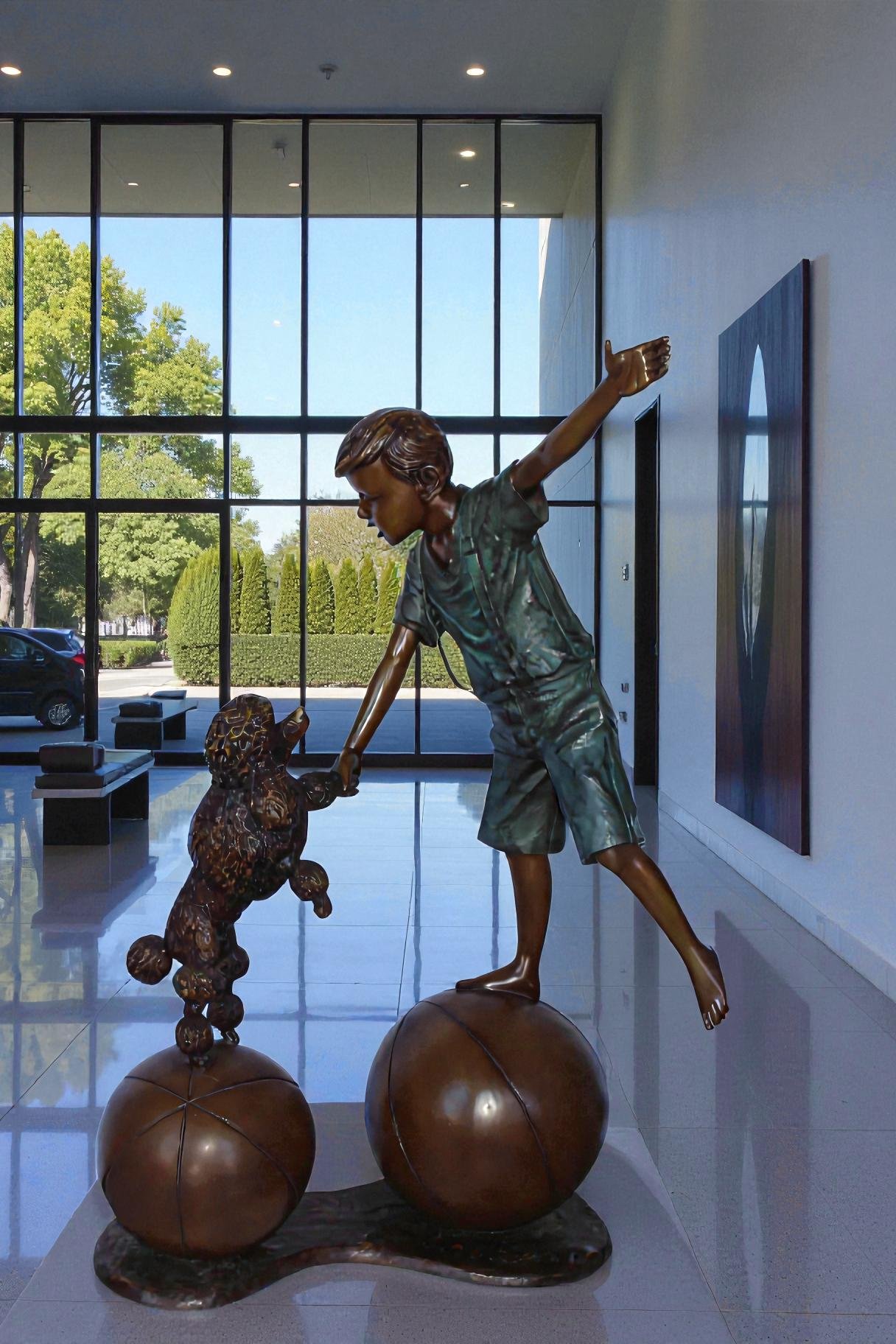Boy and poodle balancing circus stars bronze statue -  Size: 38" x 27" x 55"H.