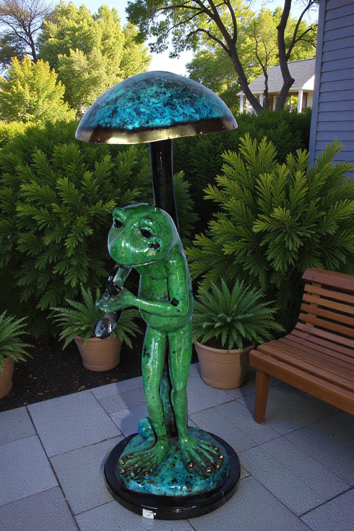 Jazzy frog perched under mushroom bronze statue   -  Size: 10"L x 10"W x 28"H.