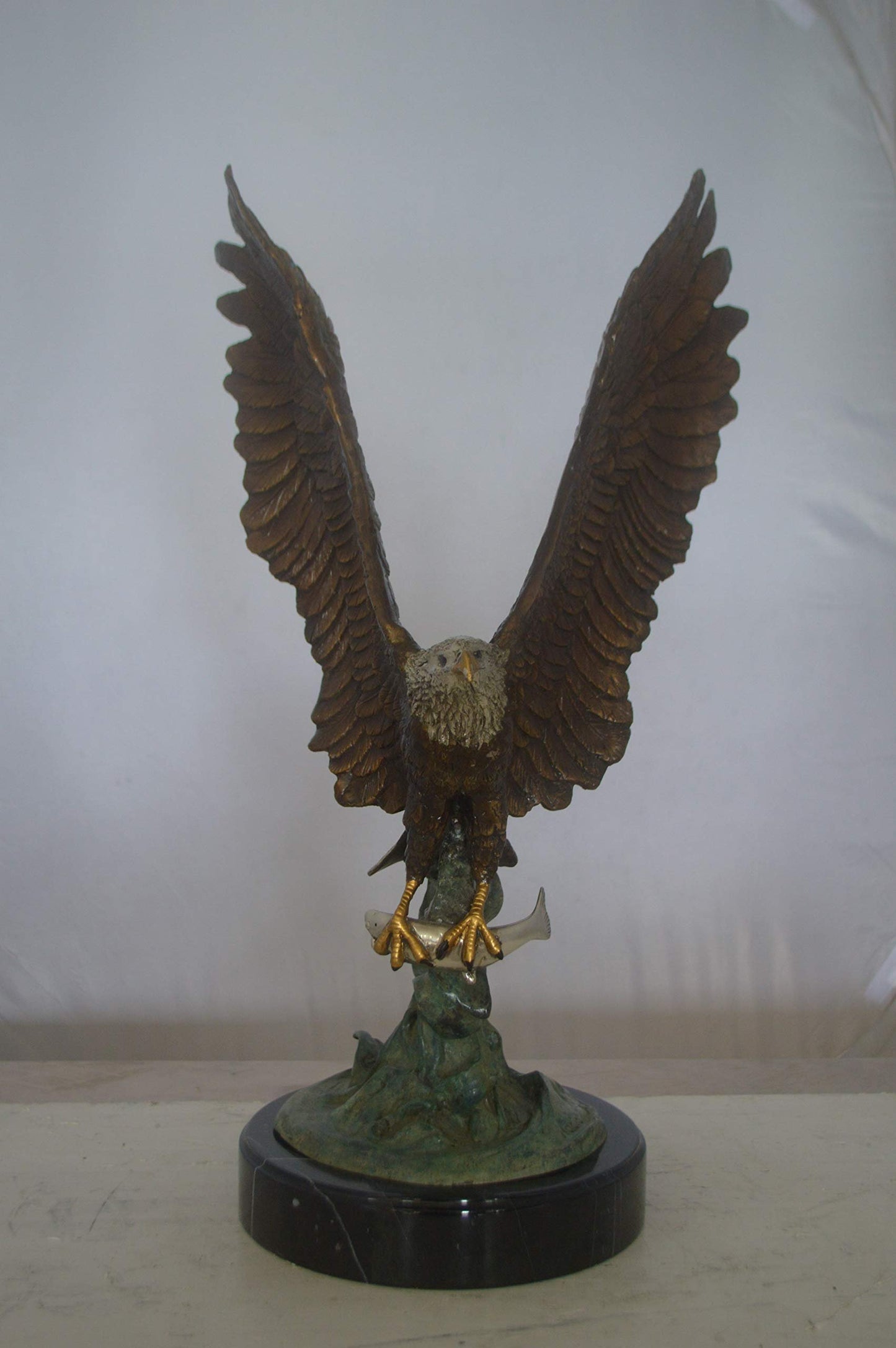 Eagle Catching His Prey from Water Bronze Statue -  Size: 14"L x 13"W x 26"H.