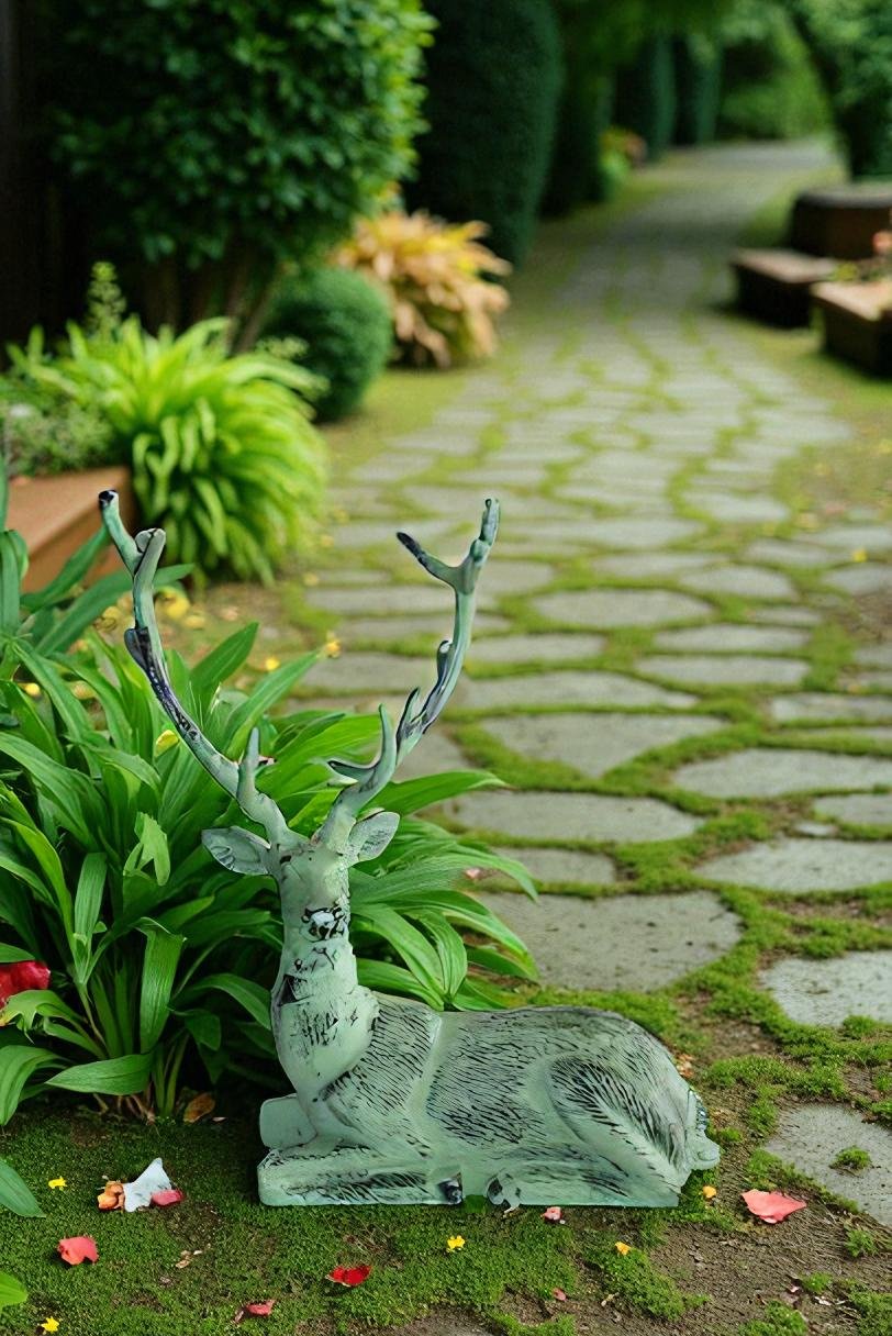Aluminum Deer Statue Green Patina Resting on the ground 26" x 7" x 24"H