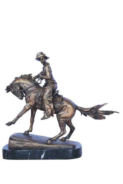 Remington replica Cowboy bronze statue -  Size: 5"L x 15"W x 13"H.