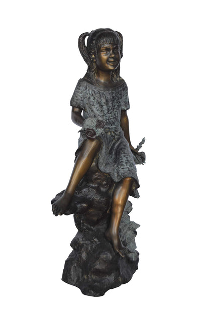 Girl on Tree  Trunk Holding Flowers Bronze Statue -  Size: 26"L x 11"W x 36"H.