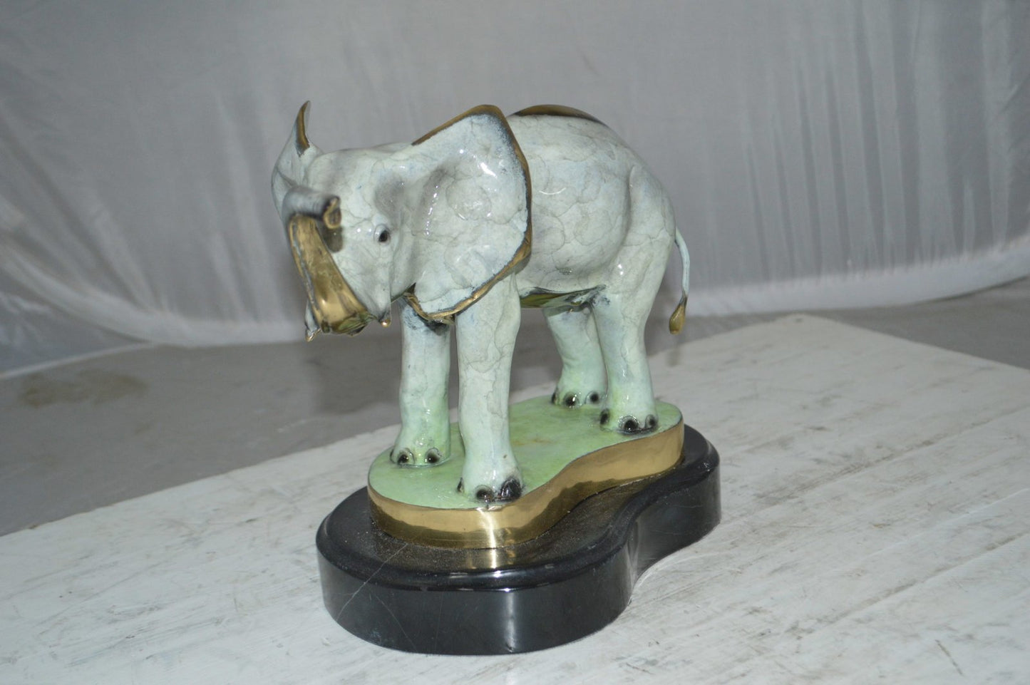 Elephant trunk Up Bronze Statue -  Size: 16"L x 9"W x 10"H.