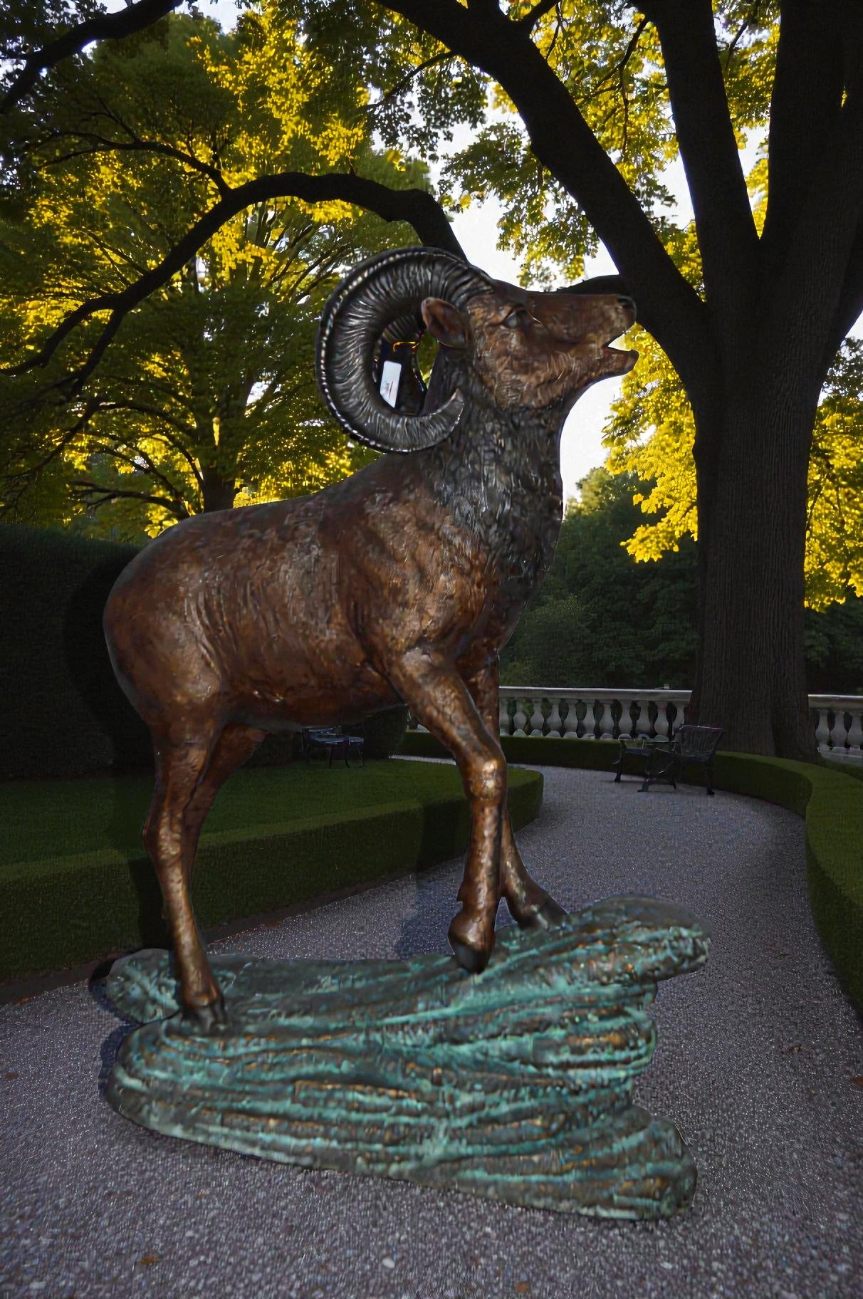 Life Size Ram standing on a rock Bronze Statue - Size: 38"L x 19"W x 45"H.