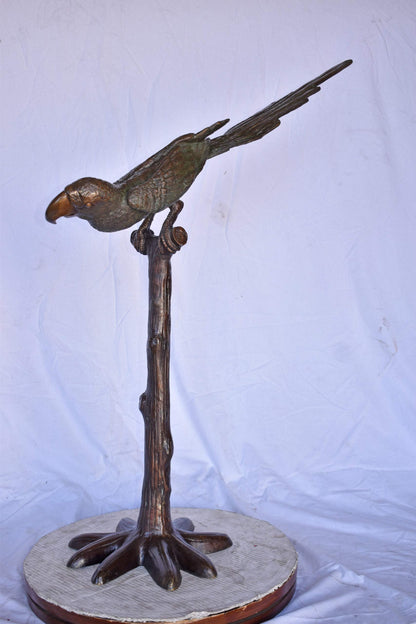 Parrot on a Tree looking Down Bronze Statue - Size: 37"L x 15"W x 47"H.