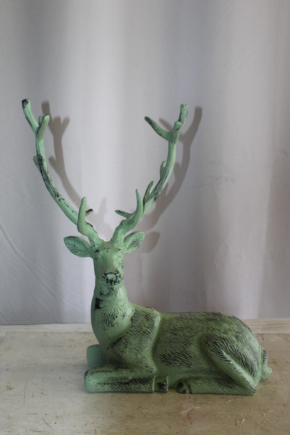 Aluminum Deer Statue Green Patina Resting on the ground 26" x 7" x 24"H