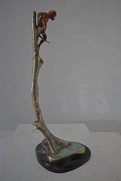 Colored Monkey Resting on a Tree Bronze Statue - Size: 12"L x 13"W x 27"H.
