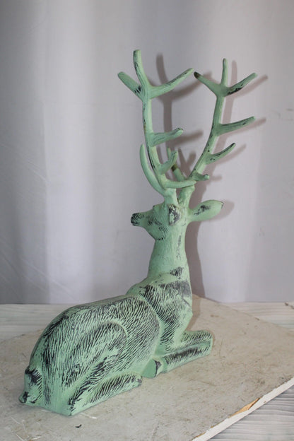 Aluminum Deer Statue Green Patina Resting on the ground 26" x 7" x 24"H