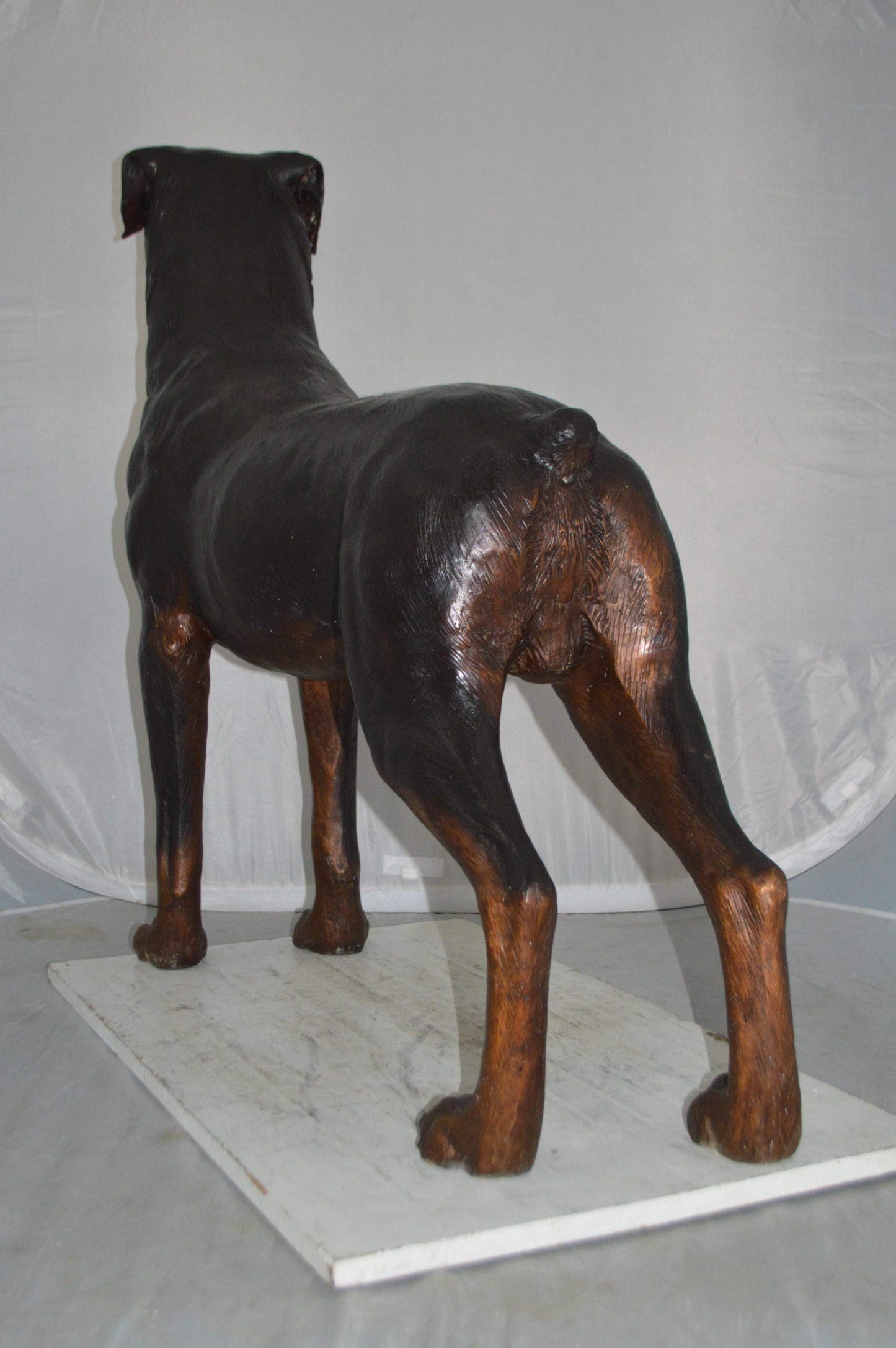 Rottweiler Dog Bronze Statue -  Size: 44"L x 10"W x 36"H.