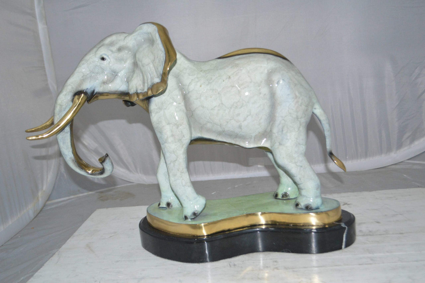 Elephant trunk Down Bronze Statue -  Size: 28"L x 12"W x 17"H.
