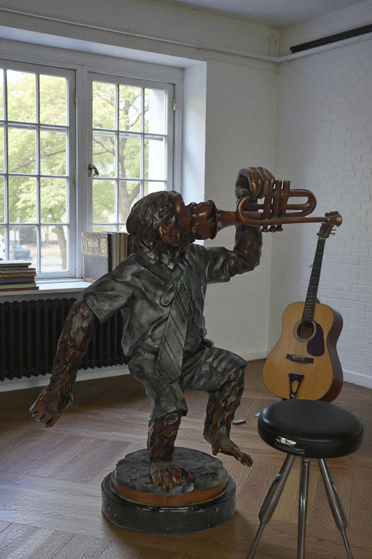 Monkey With Trumpet Bronze Statue - Size: 24"L x 12"W x 26"H.