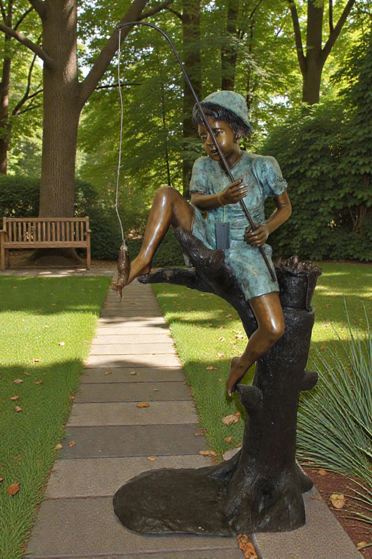 Boy Sitting on a Tree and Fishing Bronze Statue -  Size: 34"L x 28"W x 64"H.