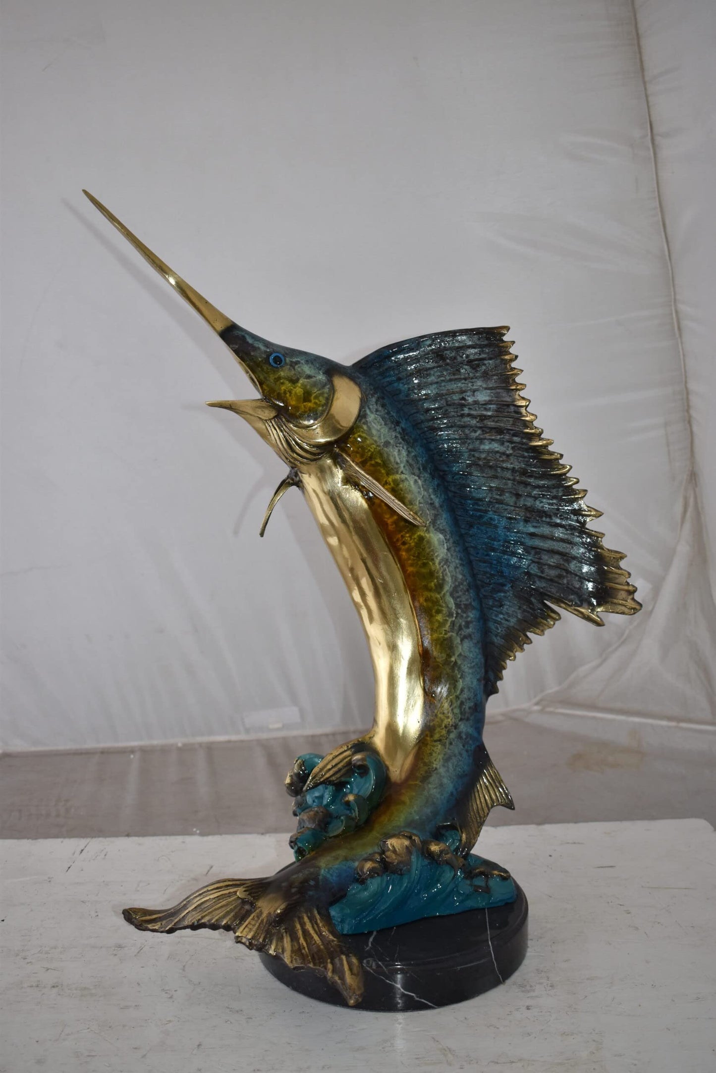 Gold And Blue Sailfish Swimming In Ocean Bronze Statue Size: 18" x 16" x 26"H
