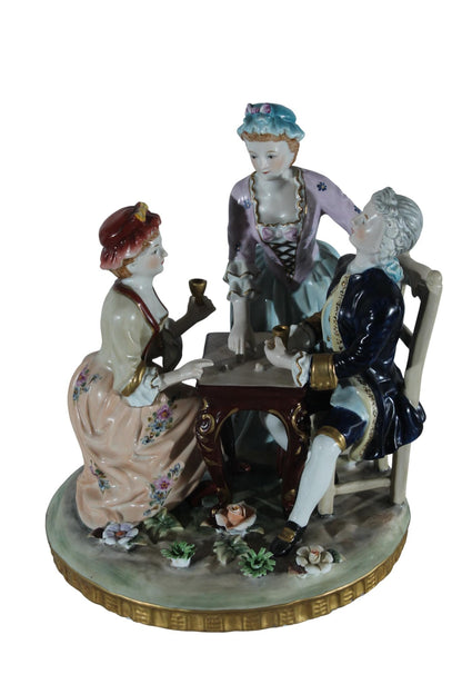 NIFAO Porcelain Figurine Group at Table with Cups 10"x10"x13"H
