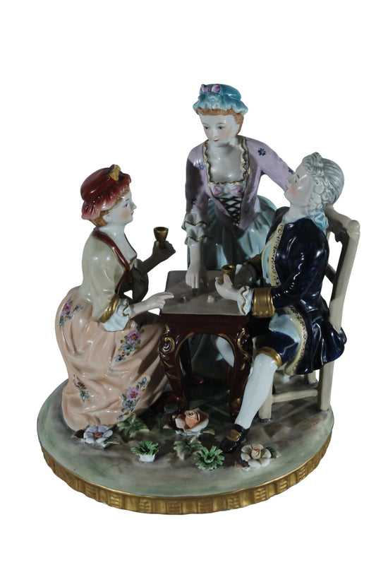 NIFAO Porcelain Figurine Group at Table with Cups 10"x10"x13"H