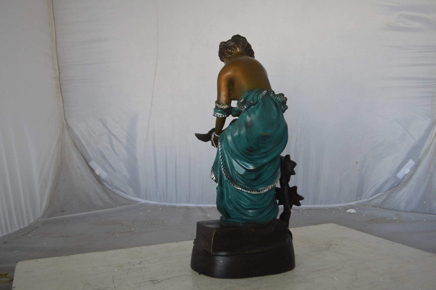 Lady holding a bird bronze statue - Size: 10"L x 9"W x 20"H.