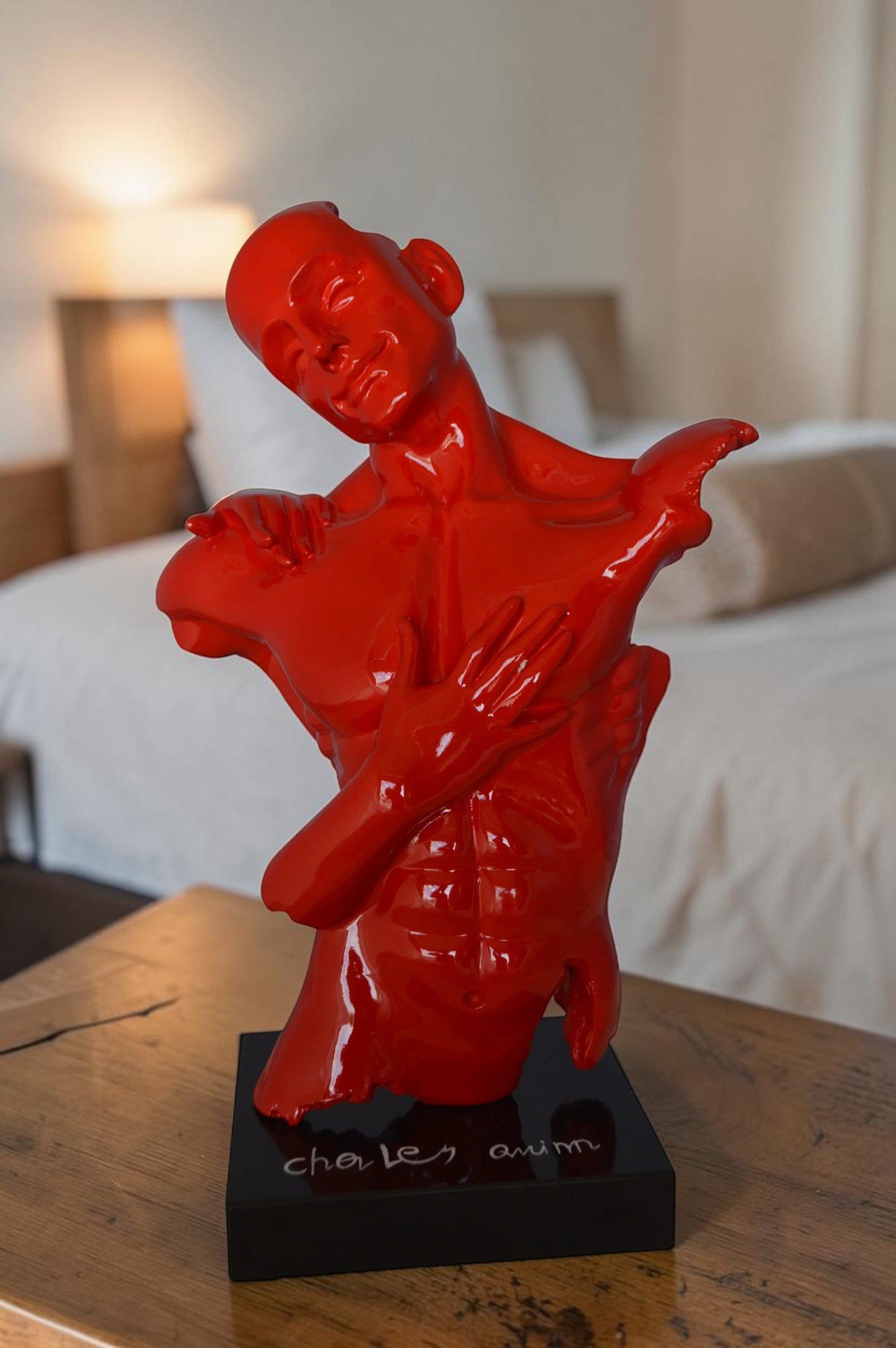 Modern resin statue of a man hugged by a woman -  Size: 17"L x 8"W x 24"H.