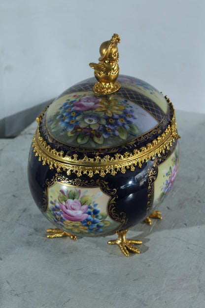 NIFAO Porcelain floral egg shaped lidded box with cherub and chicken feet 11"x8"x12"H