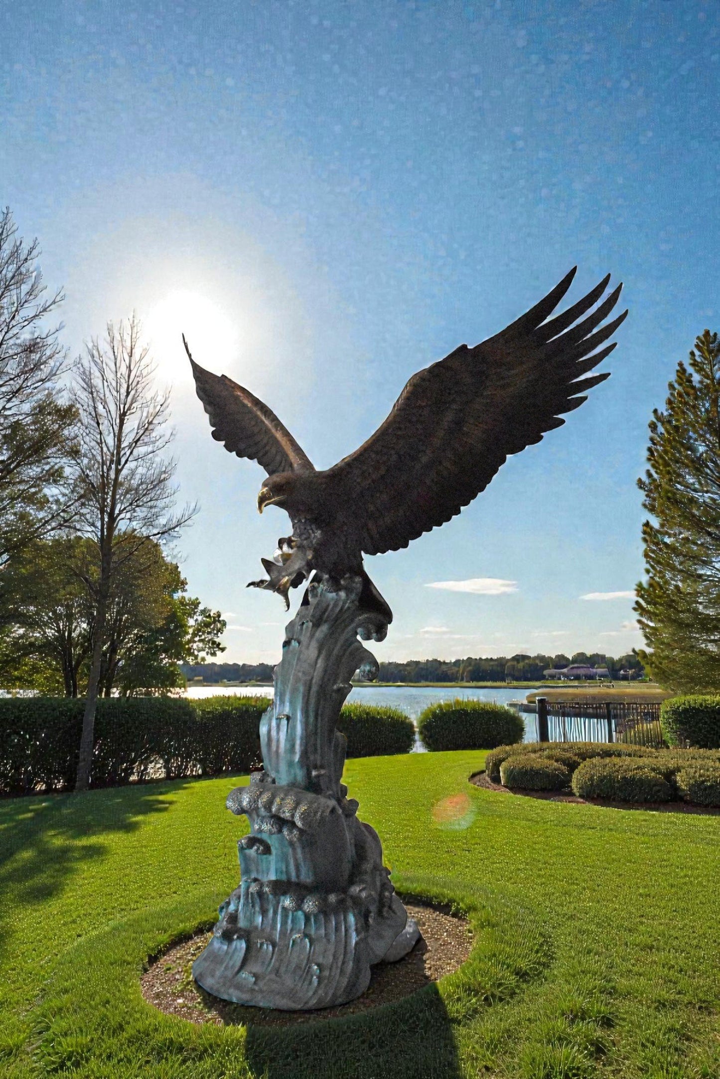 Eagle in Action Catching His Prey Bronze Statue - Size: 68"L x 40"W x 87"H.