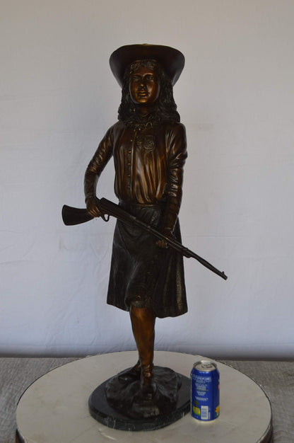 Annie Oakley Bronze Statue Mounted on a Marble Base -  Size: 11"L x 9"W x 33"H.