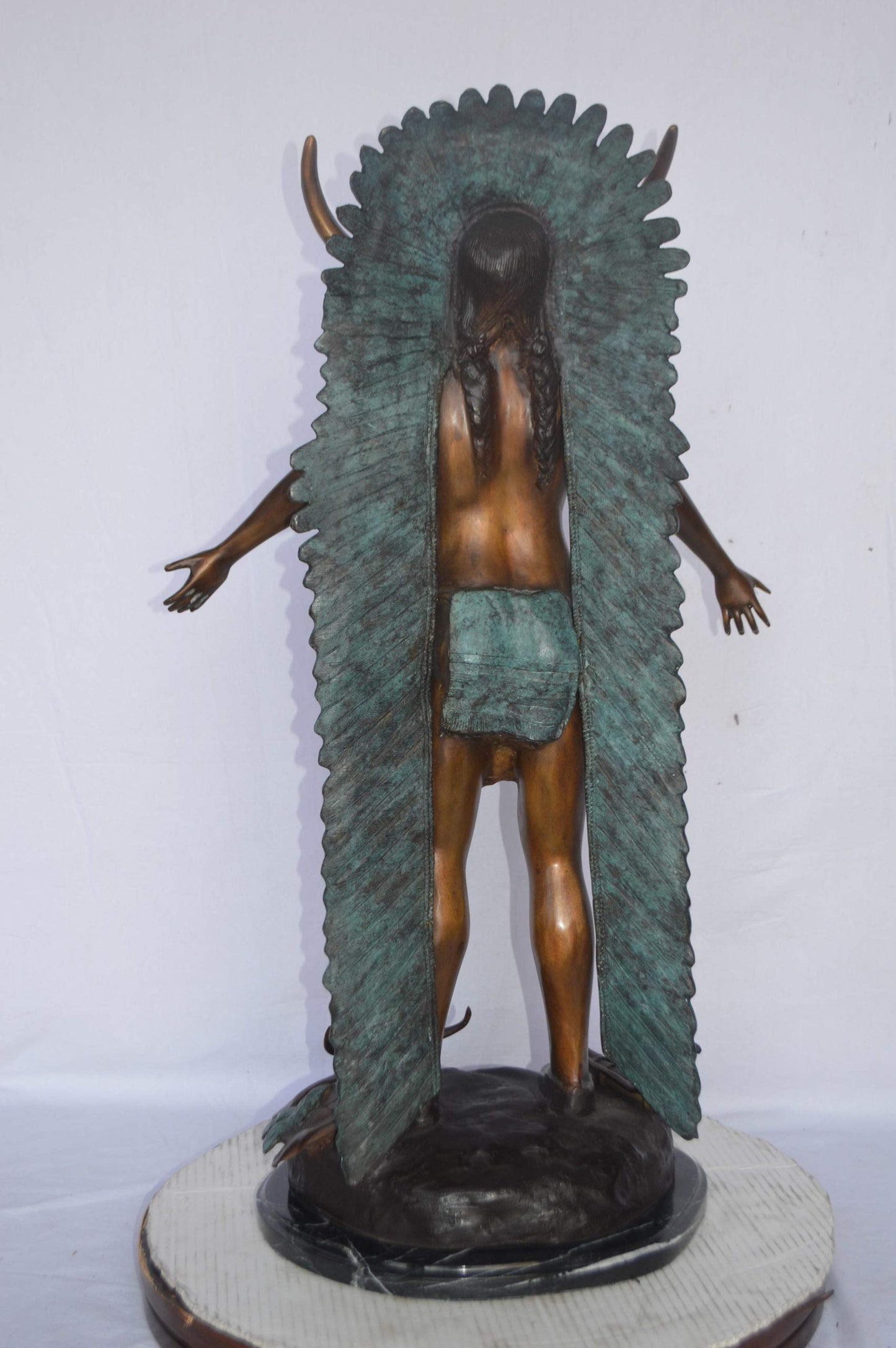 Indian with Plume bronze statue - Size: 22"L x 14"W x 38"H.