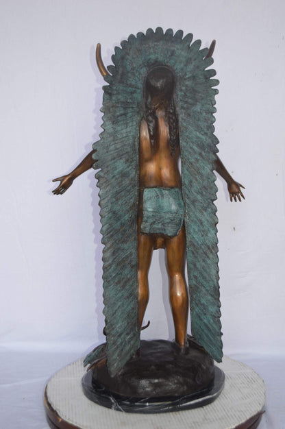 Indian with Plume bronze statue - Size: 22"L x 14"W x 38"H.